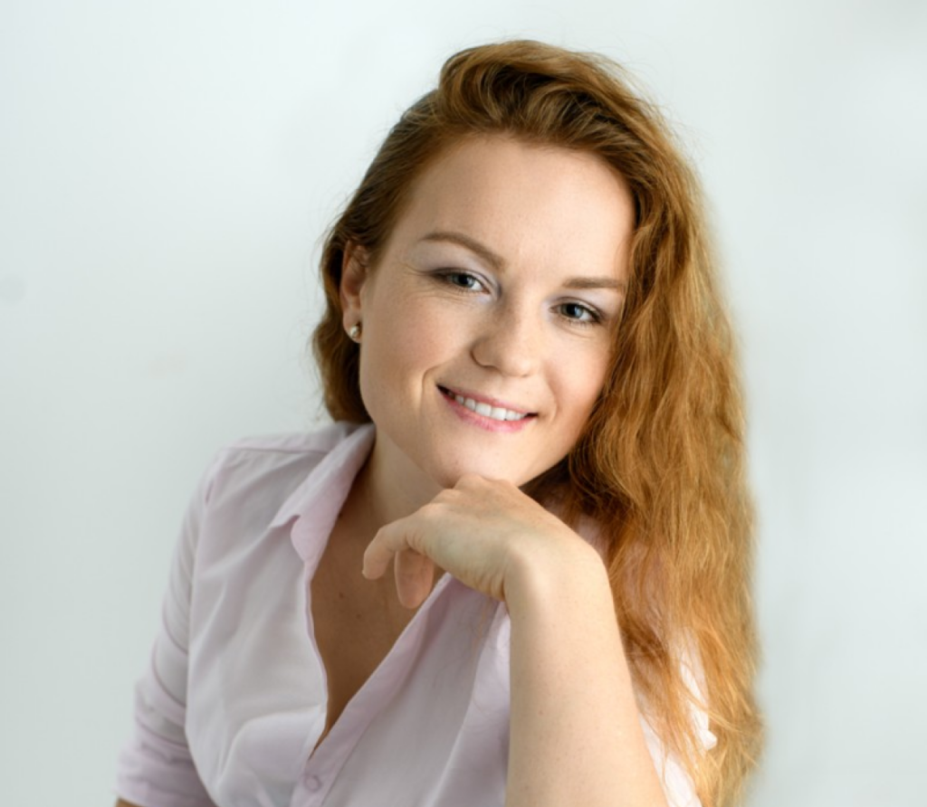 a woman with her hand on her chin